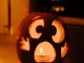 a jack-o'-lantern with a candle in it