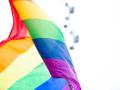 The rainbow LGBTQIA flag flapping in the wind