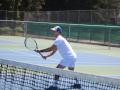 Student playing tennis 