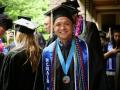 Male graduate with lots of cords, medallion and sashes