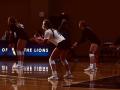 Women playing volleyball indoors