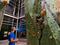 People climbing the rock climbing wall in the SSU Rec Center