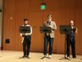 Three people playing instruments in a recital