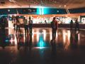 people rollerskating in an indoor roller rink