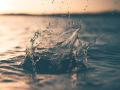 Water splashing in a large outdoor body of water 