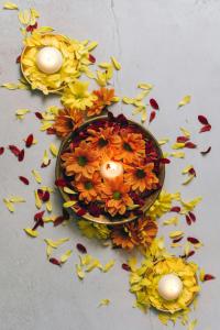 Diwali Candles and Flowers Colorful flower petals and tealights