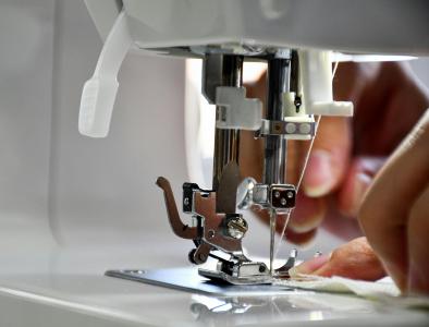 Sewing Machine Someone using a sewing machine