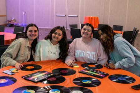 Students sitting at a craft table 