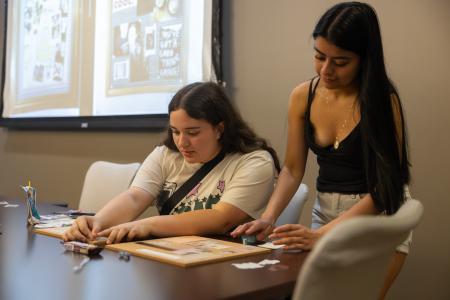 Students sitting at a craft table 