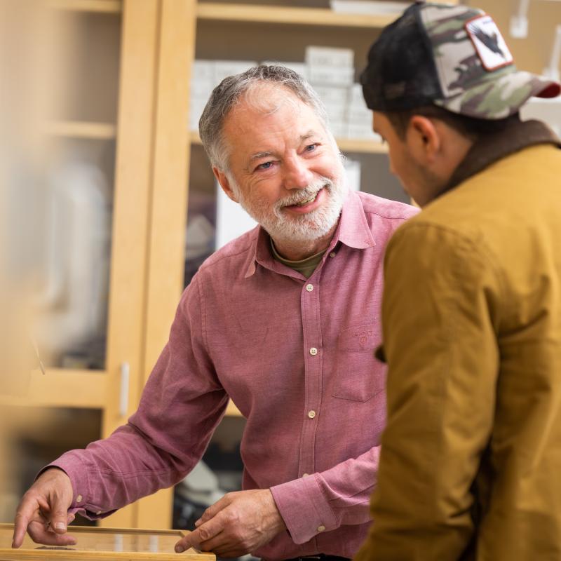 Biology professor speaking to student